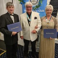 Mike Champion, District Governor, with new Paul Harris Fellows President Sue Kirkham, and Ian Caplan